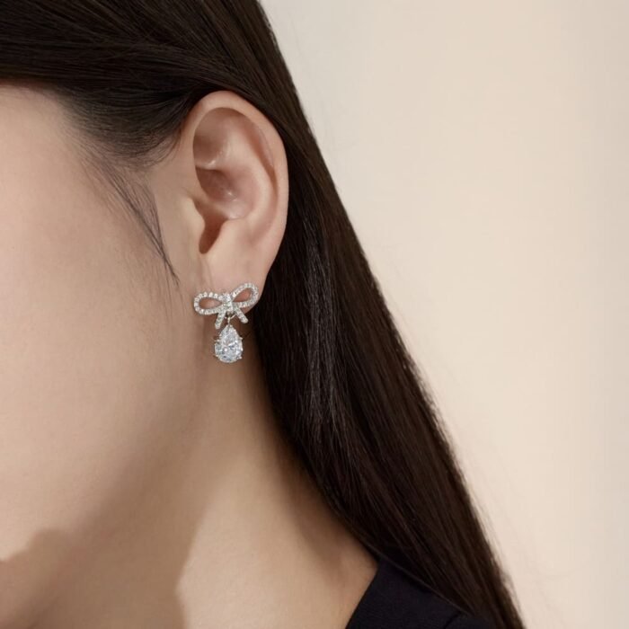 Aurojewels White Pear Drop Bow Design Earrings