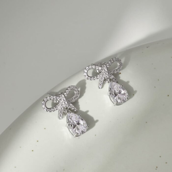 Aurojewels White Pear Drop Bow Design Earrings