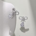 Aurojewels White Pear Drop Bow Design Earrings