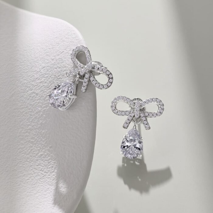 Aurojewels White Pear Drop Bow Design Earrings