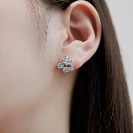 model trying on picture of Aurojewels S925 Sterling Silver White Round Zirconia Fashion Earrings